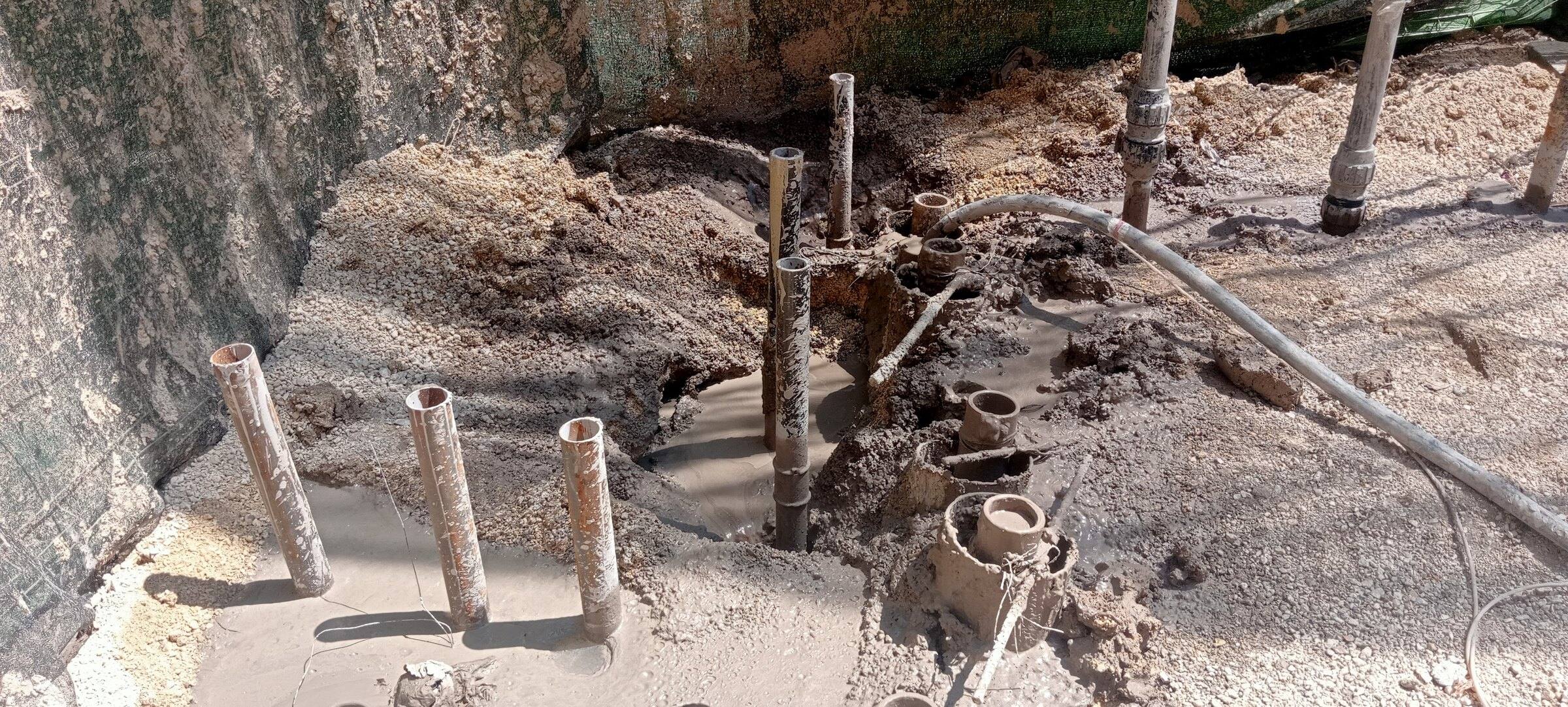 Steel micropile heads standing out of the ground at the start of the excavation.